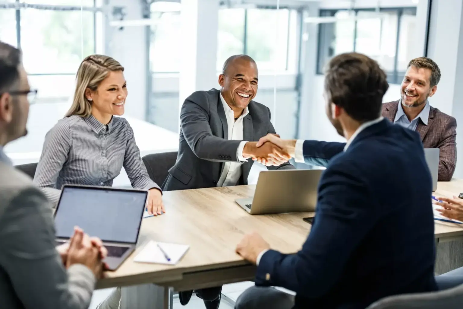 Shaking-Hands-in-Business-Meeting-scaled-2-1536x1024